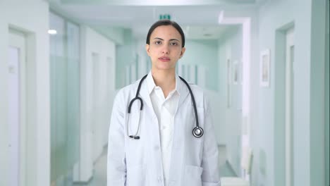 indian female doctor talking to the camera