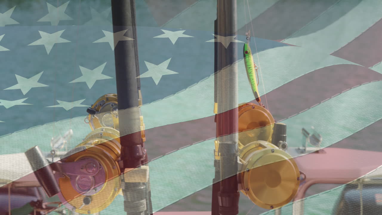 bandera estadounidense ondeando contra la vista de cerca de dos cañas de pescar en un barco