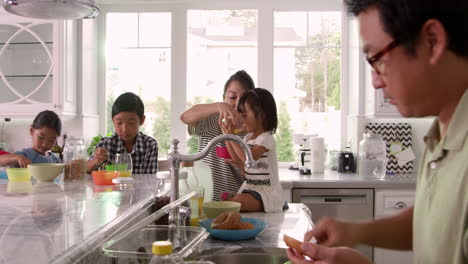 family having breakfast and making lunches shot on r3d