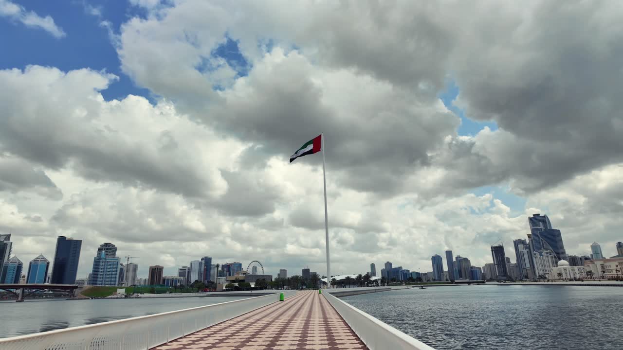 A view of the UAE national flag under overcast conditions in Sharjah