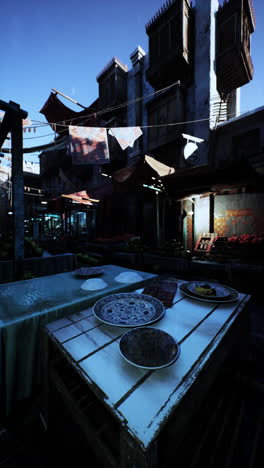 a bustling marketplace in a city with traditional buildings and street vendors selling produce