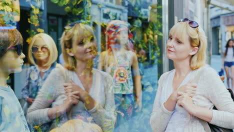 A-young-woman-traveler-looks-at-the-window-of-a-clothing-store-1