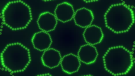 circular symmetrical pattern of green dots on black background