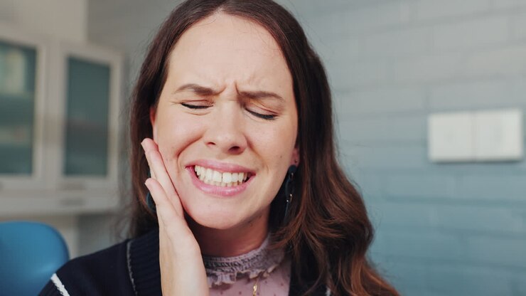 Woman experiencing toothache
