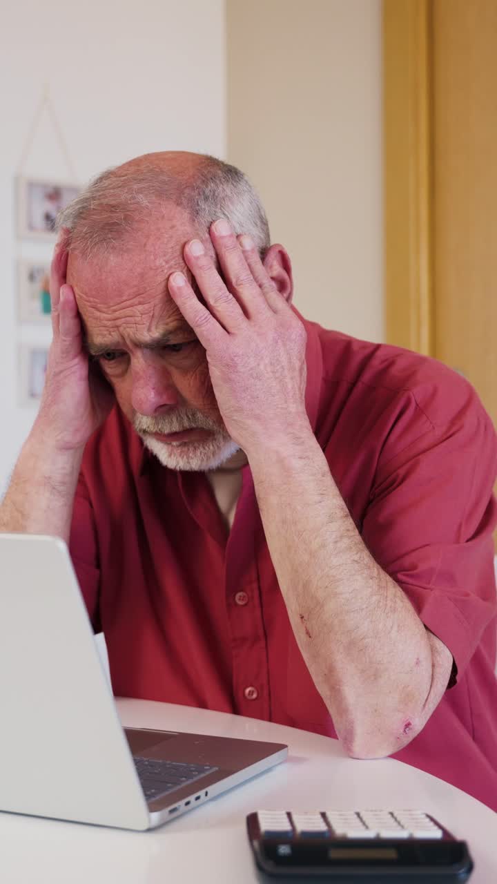 Frustrated Senior Man Struggling with Finances on Laptop