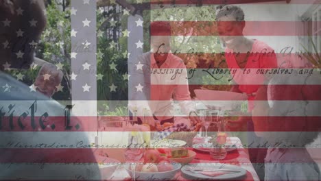 animation of flag of united states of america waving over smiling african american family