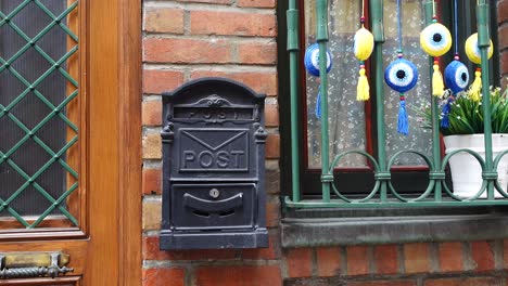 european house exterior with mailbox and decorations