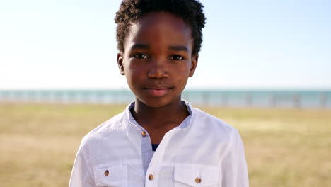portrait of a young boy at the beach