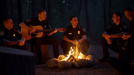 police officers around a campfire