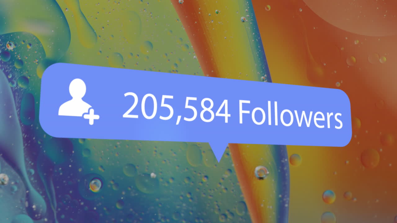 Animation of social media icon and text over close up of liquid and baubles
