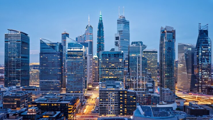 Cityscape at Dusk with Modern Skyscrapers and Lit Buildings