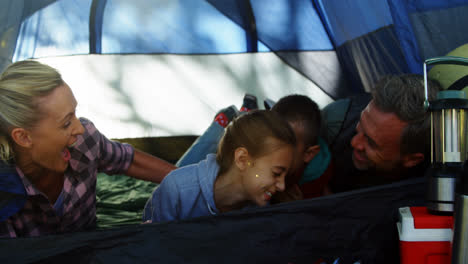 Smiling-family-lying-in-the-tent