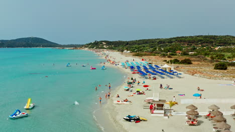 Flying-low-over-Villasimius-beach-in-Sardinia,-Italy