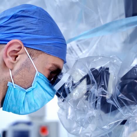 surgeon with operating microscope
