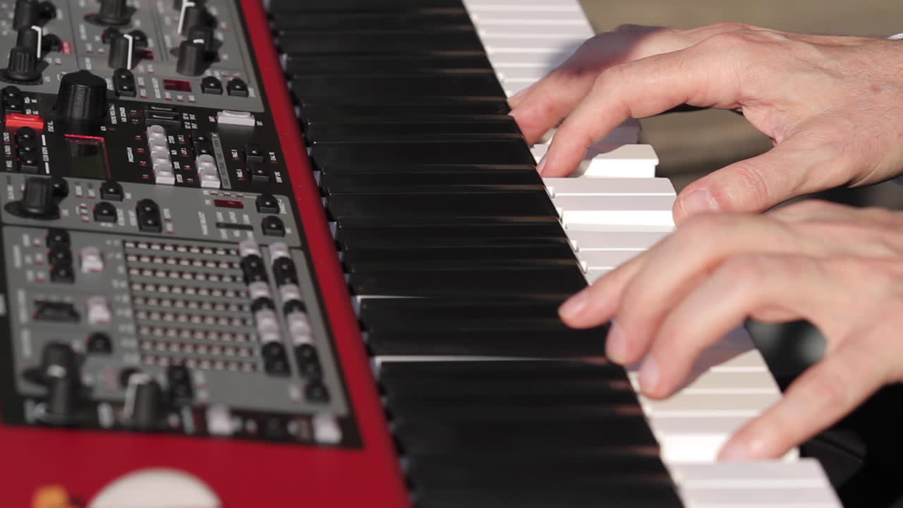 Close-up of hands playing a keyboard