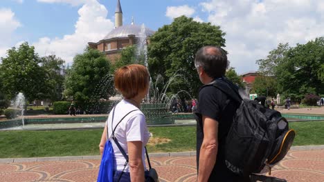 mature travelers couple contemplating the beauty of sofia- mosque in background
