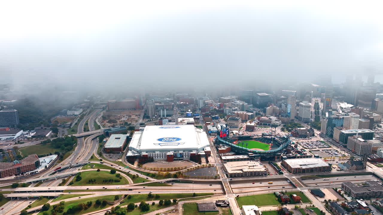 Detroit, USA, 28 July 2025: Fog above Ford Field and Detroit. Low mist covers downtown while stadium roofs and roads stay clear