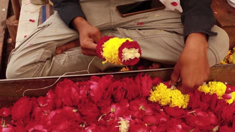 In-India,-where-flower-garlands-have-an-important-and-traditional-role-in-every-festival,-Hindu-deities-are-decorated-with-garlands-made-from-different-fragrant-flowers-(often-jasmine)-and-leaves.