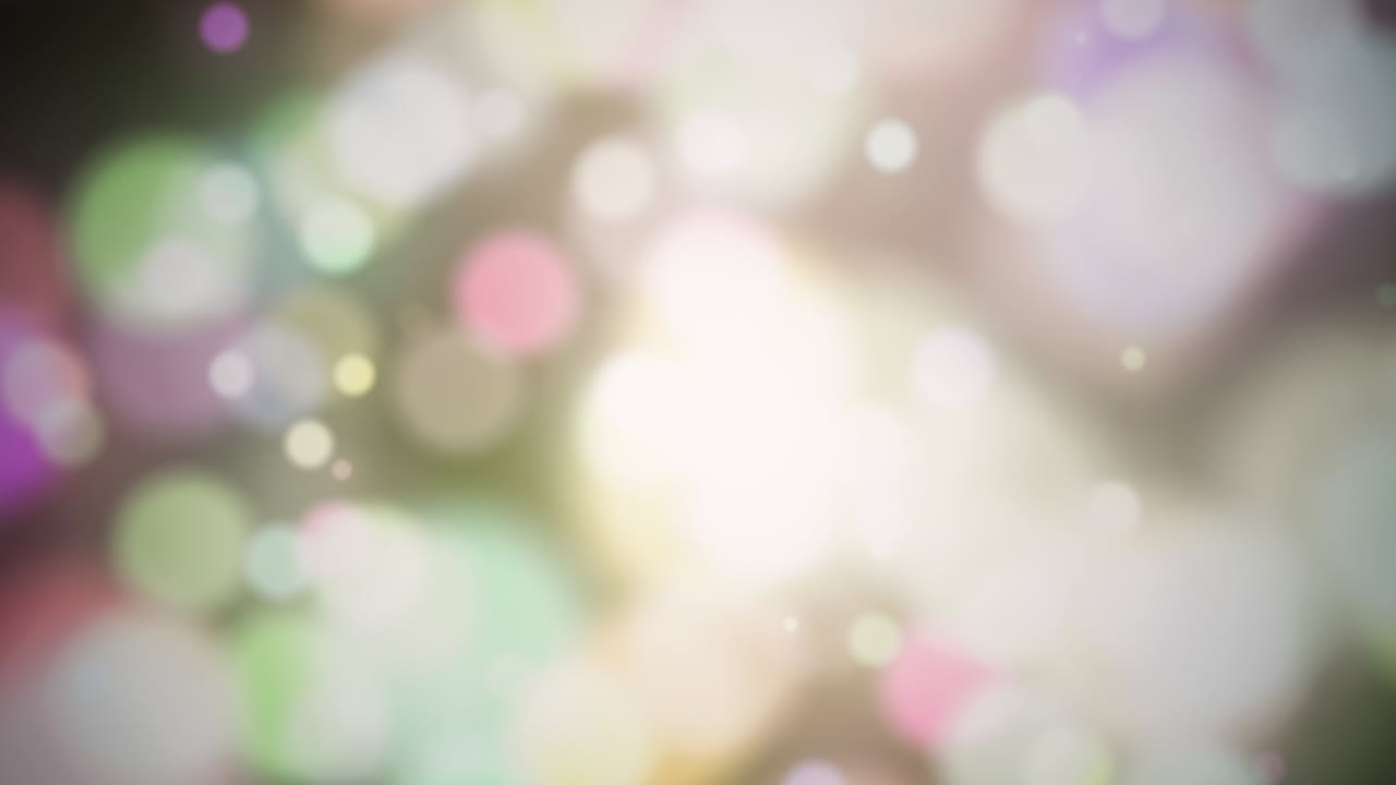 Abstract colorful bokeh texture on dark background. Looped animation seamless loop. Bokeh lights.