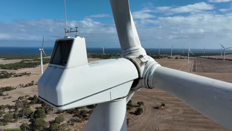 very close orbiting shot of wind turbines spinning