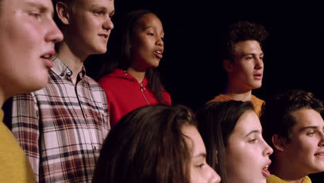 teenagers rehearsing in a theatre