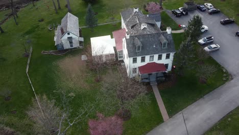 drone footage over house and parking space at suburb residential area in chesterbrook, pennsylvania, usa