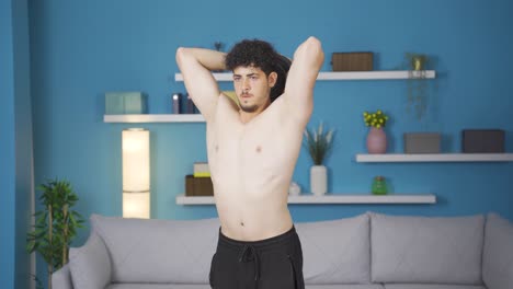 athletic young man exercising with barbell, arm muscle. muscular body.