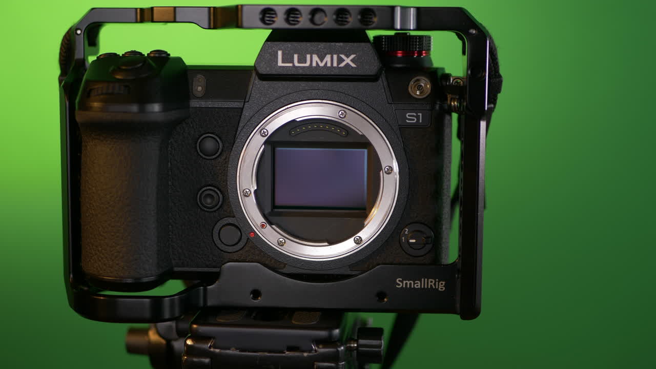 Dolly in on a modern mirrorless camera, without lens, exposing full frame sensor.