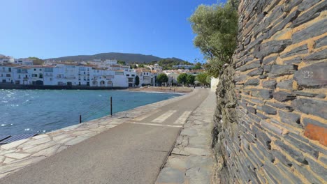 Cadaques-on-the-Costa-Brava-of-Girona,-fishing-village-where-Salvador-Dali-lived,-road-facing-the-sea