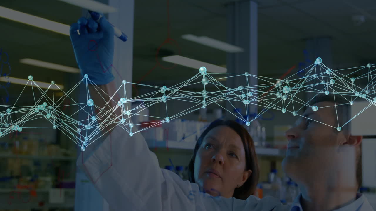 In laboratory, scientists analyzing animation of holographic network connections for research