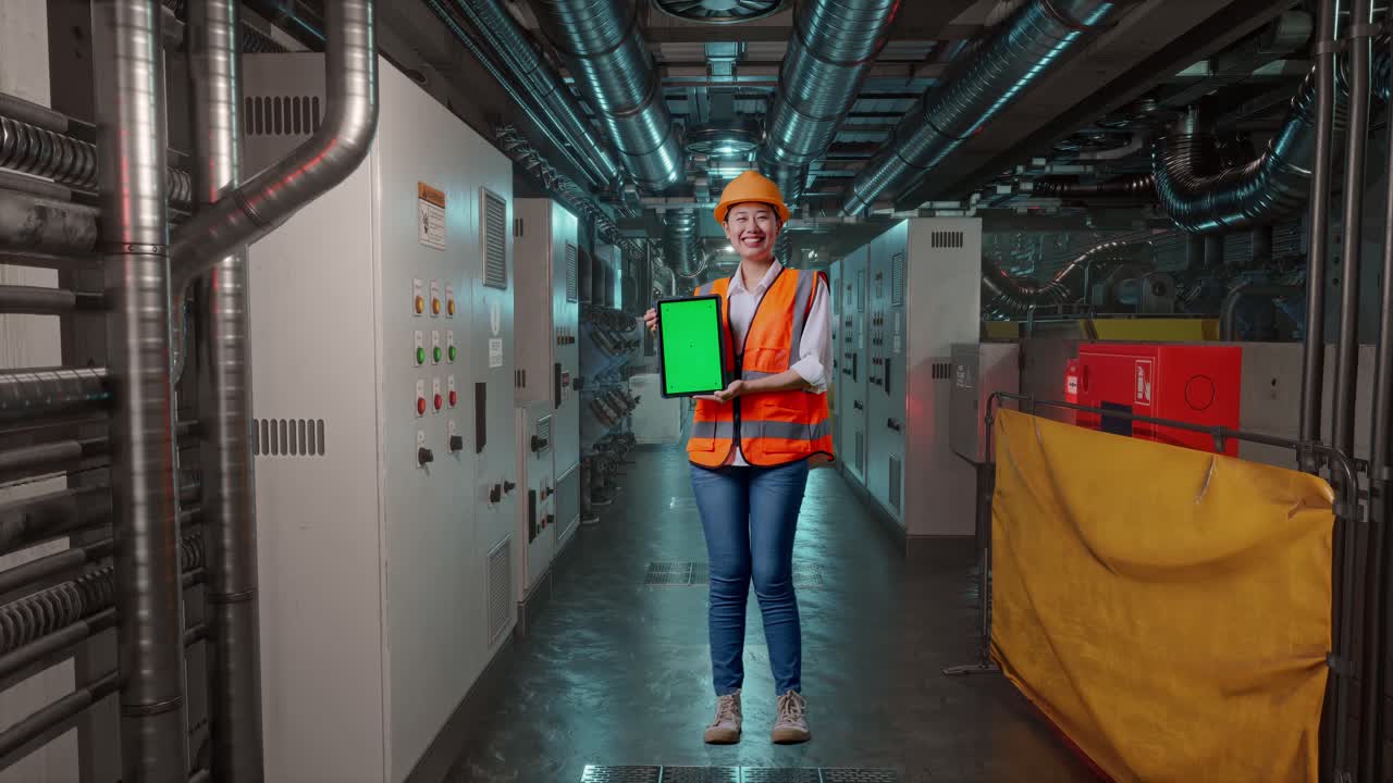 Female Engineer Holding Tablet in Industrial Setting