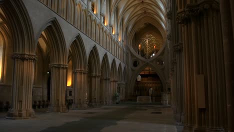 stunning, smooth gliding shot looking down the spectacular nave inside wells cathedral, with its stuning arches and vaulted ceiling, in wells, england