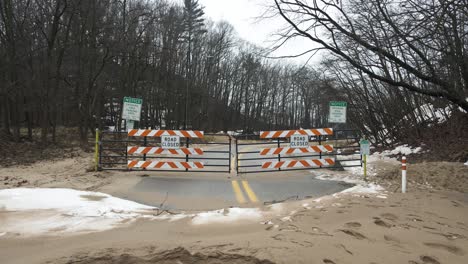 still look at the closed road signs after winter weather forced the seasonal closure of beach street