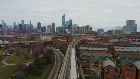 bird's eye view tracking shot of cta subway train on chicago's south side