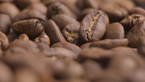 macro close up, roasted coffee beans spinning shot