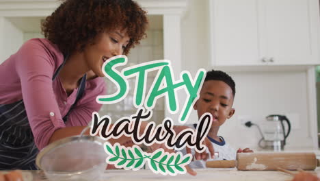 animación de estancia texto natural sobre feliz afroamericana madre e hijo cocinando en casa