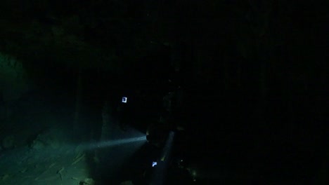 cave diver makes a jump