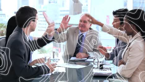 Topography-against-diverse-businesspeople-high-fiving-each-other-in-a-meeting-room-at-office