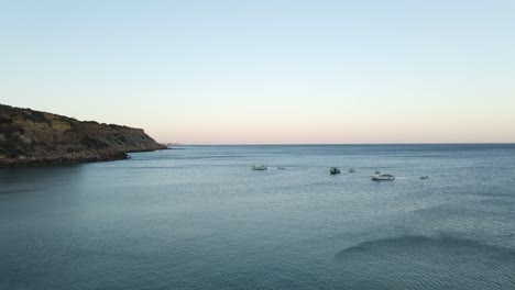 Aerial-footage-of-several-fishing-boats-docked-in-the-water