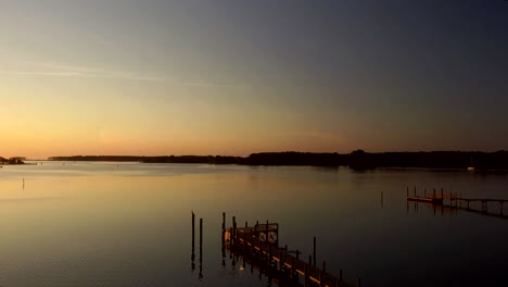 Sunset-on-Pungoteague-Creek,-flying-over-docks-on-the-Eastern-Shore-of-Virginia