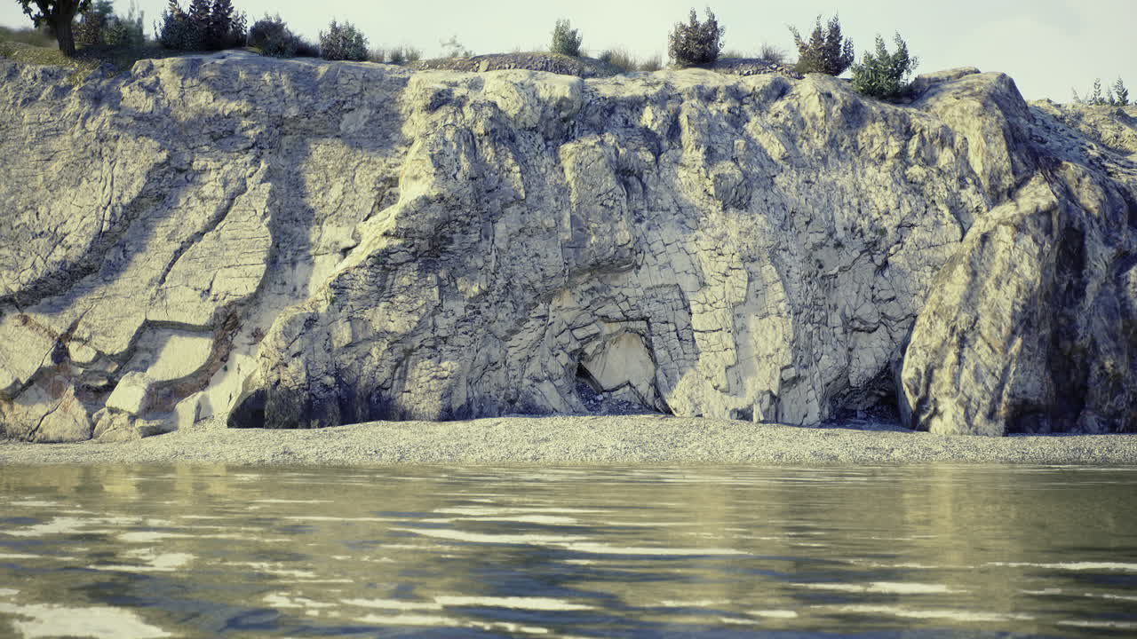 Rocky shoreline with unique geological formations beside calm water