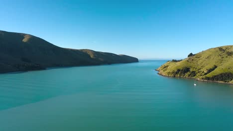 aerial view over port levy, a maori settlement on banks penninsula in canterbury new zealand