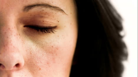 woman in slow motion opening her eye