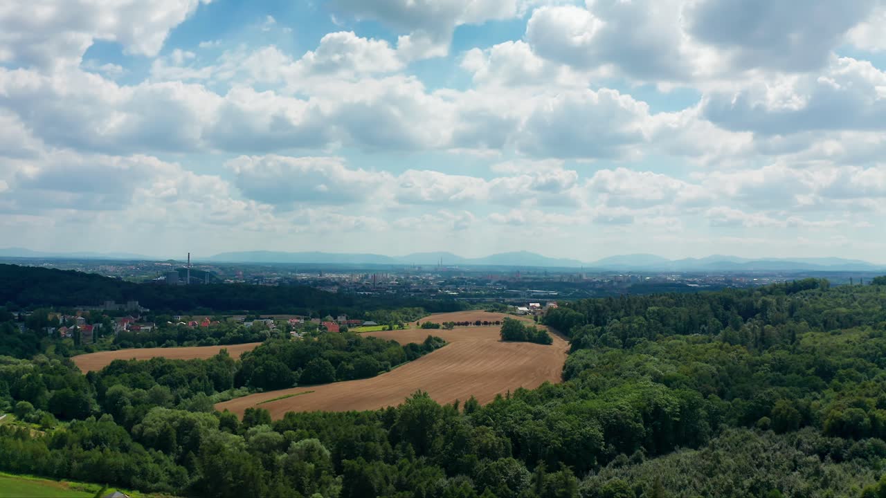 Aerial drone shot of czech big city Ostrava with Beskydy mountains behind during summer