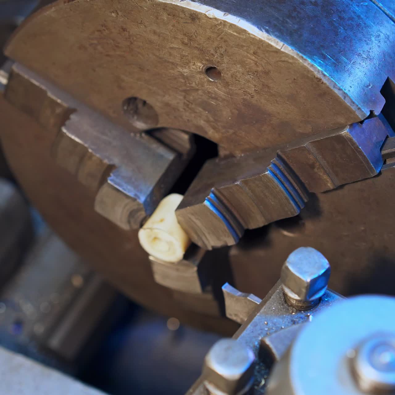 New machine stand industry. Modern turner working with instrument