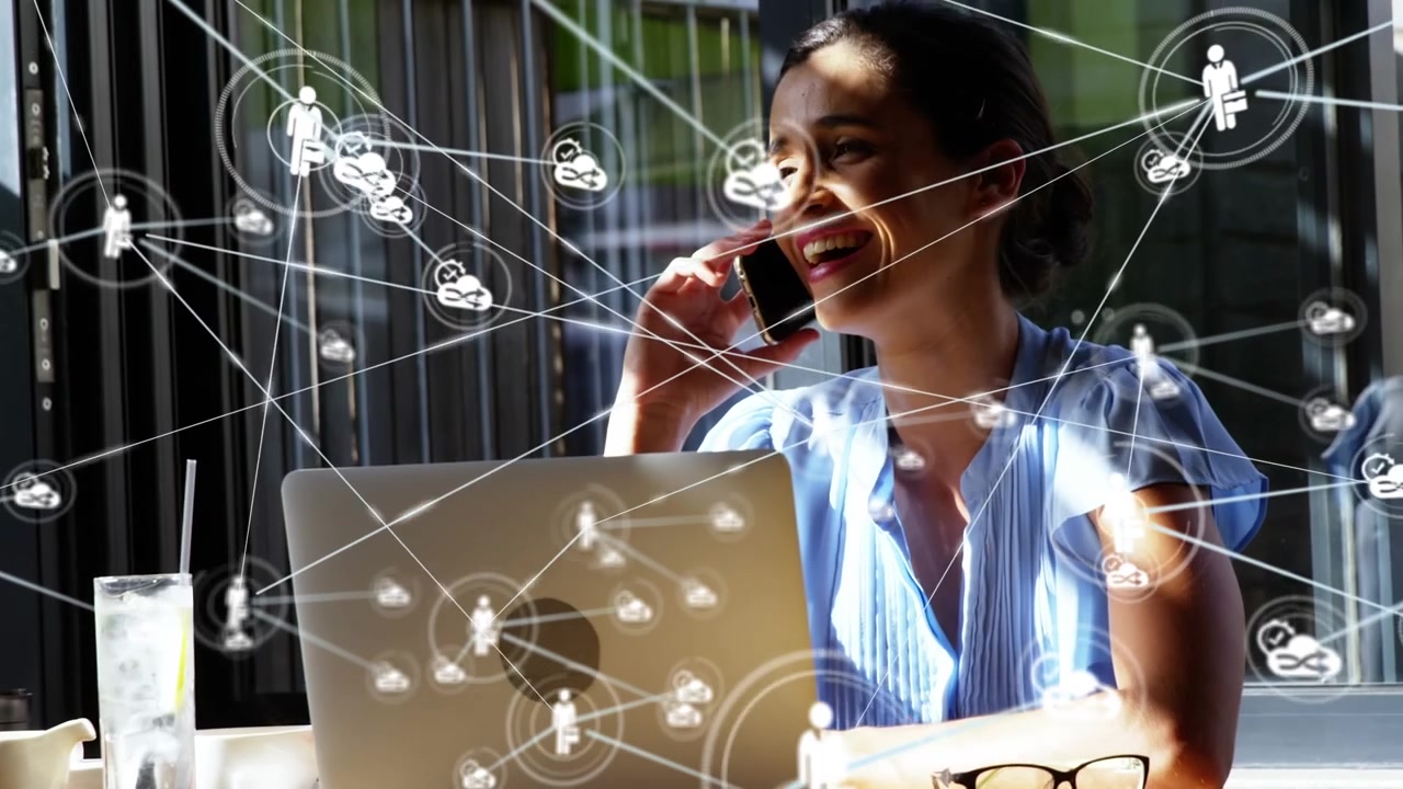 Animation of network of connections with icons over businesswoman talking on smartphone