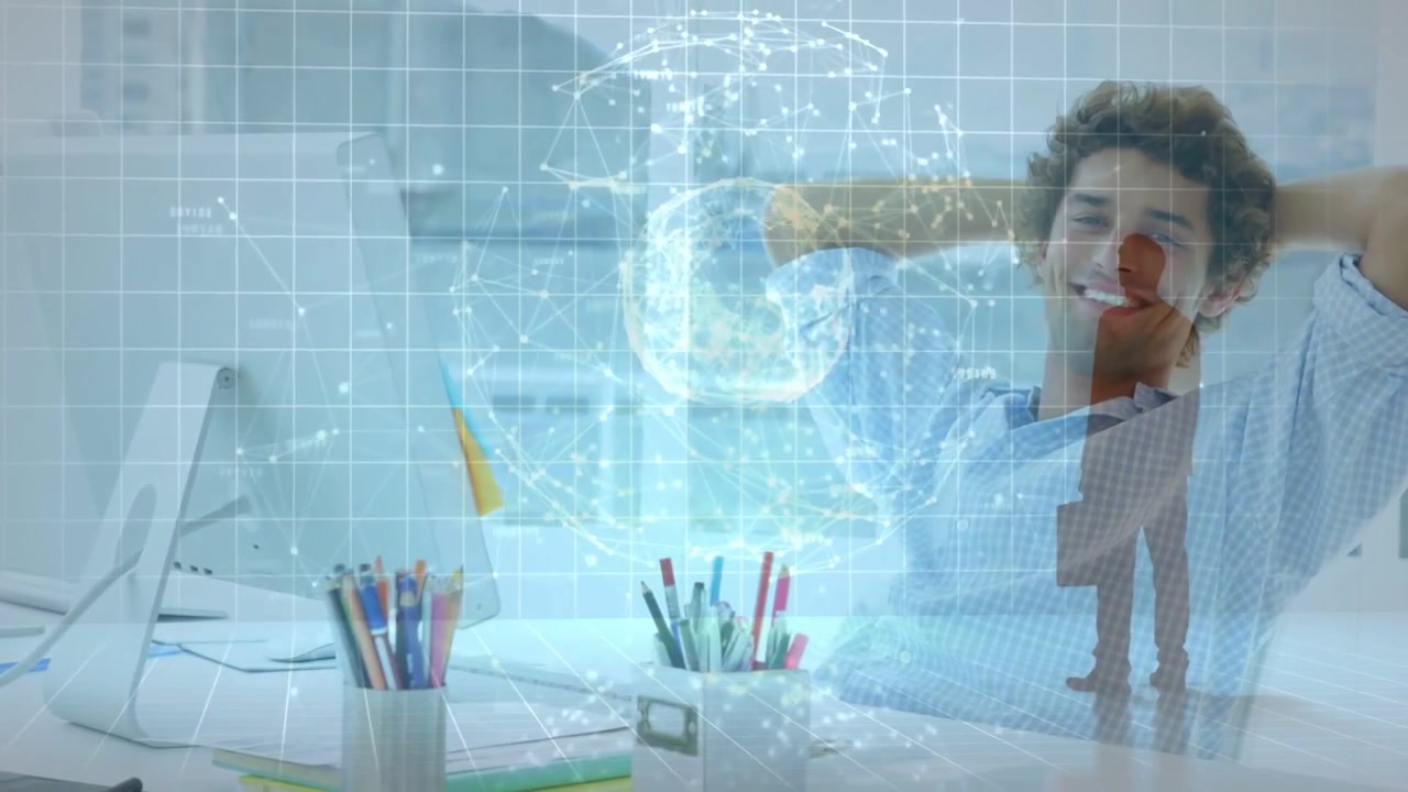 Vertical video: Man at desk seeing screen showing grid globe overlay, leaning smiling for tech demo