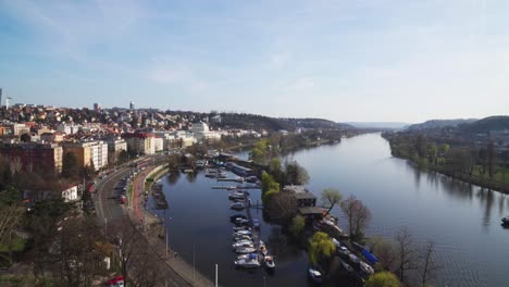 Beautiful-view-from-Prague-Upper-Castle,-Vltava-river-and-harbor-with-boats-in-spring-colors,-static-long-shot