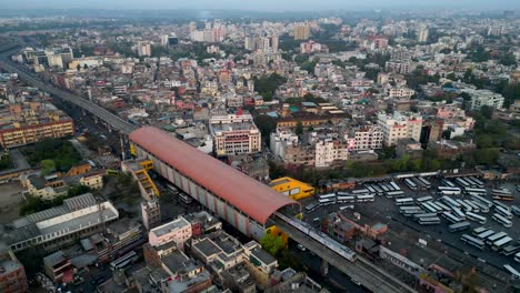 Drone-shot-Jaipur-metro-station-with-train-departing-platform-in-India