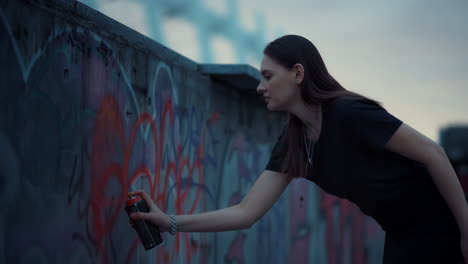 woman using aerosol paint